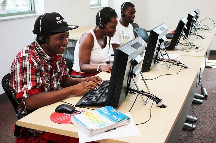 Participants working at computers in a job training lab